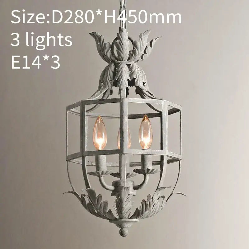 Antique-style grey gold metal cage chandelier with ornate leafy detailing and three exposed filament bulbs by decorbites gray gold