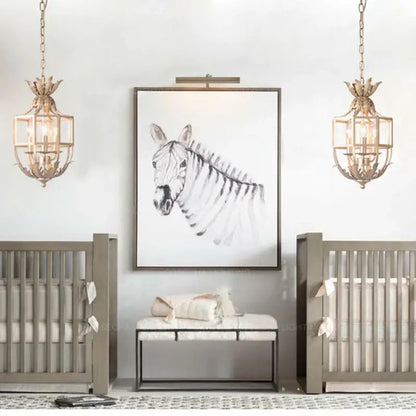Framed black-and-white zebra portrait artwork with dark wooden frame complemented by decorbites grey gold metal cage chandelier