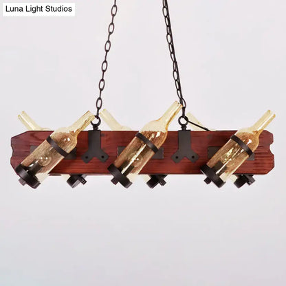 Rustic island lamp with brown wood arm featuring frosted white and amber glass wine bottle lights suspended by black metal chains