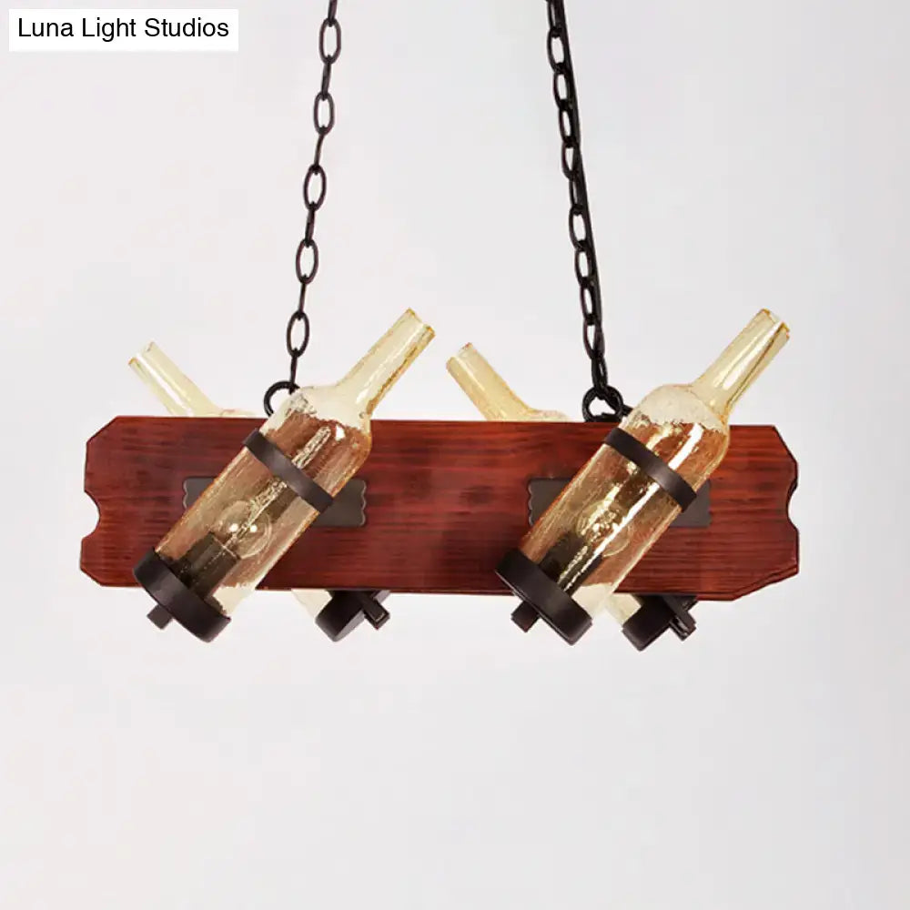Rustic island lamp with brown wood arm featuring frosted white and amber glass wine bottle pendants suspended by black metal chains