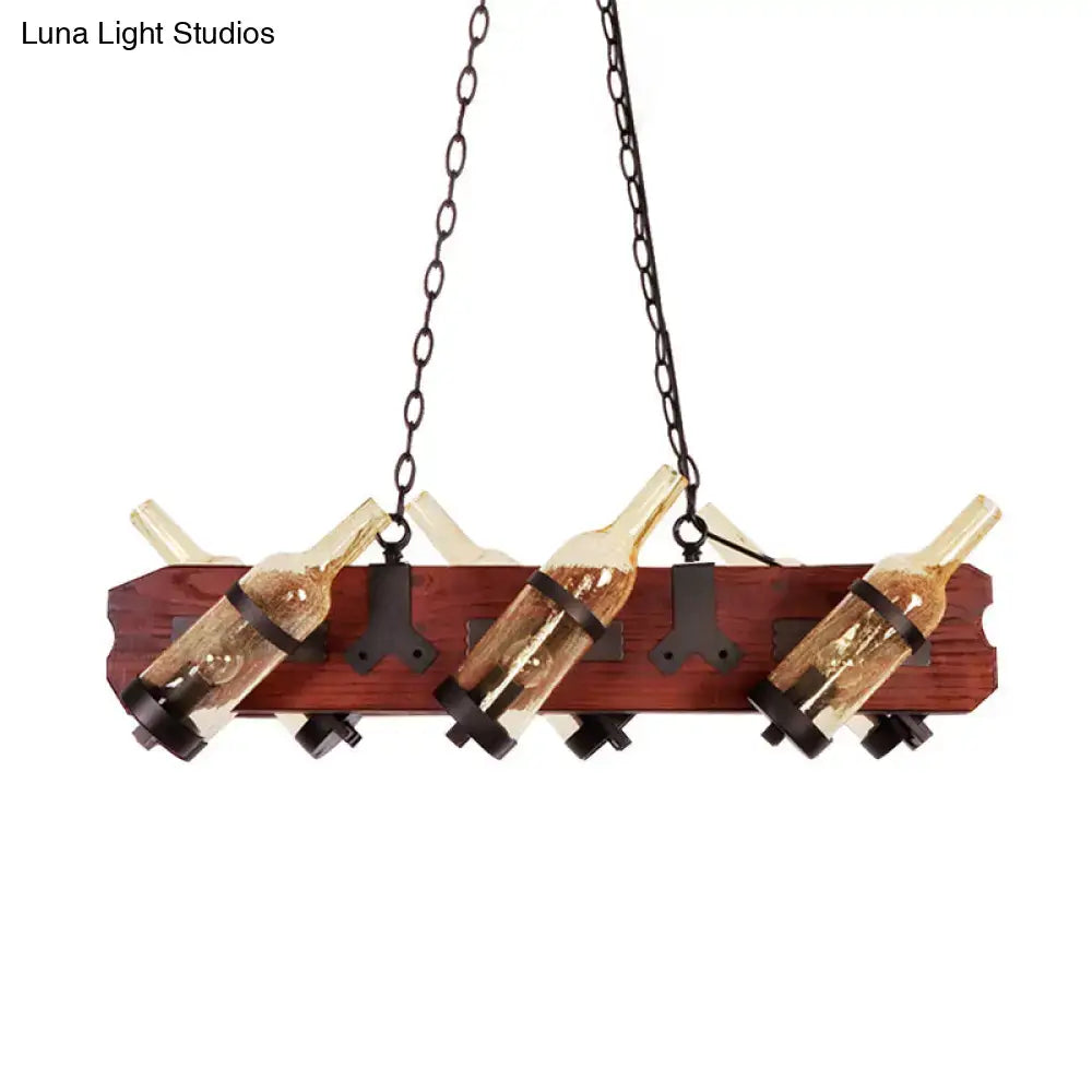 Rustic island lamp with brown wood arm, frosted white and amber glass, suspended by dark chains on metal brackets
