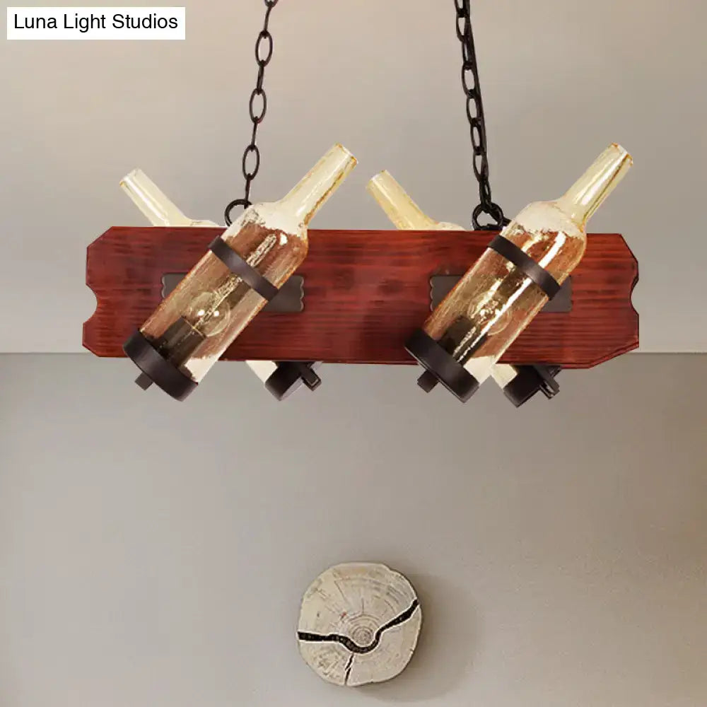 Rustic island lamp with brown wood arm featuring frosted white and amber glass pendant lights with black metal accents