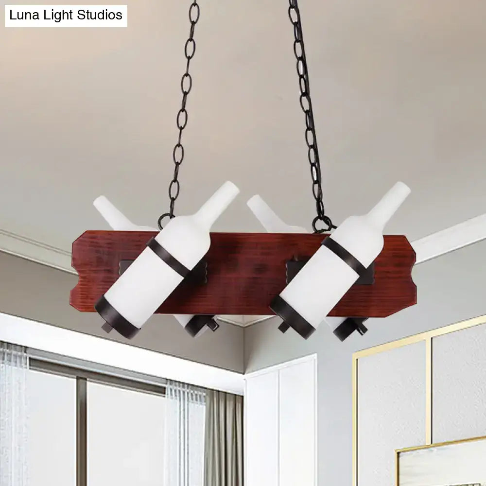 Decorbites island lamp with frosted white wine bottle pendant lights suspended by black chains on brown wood arm base