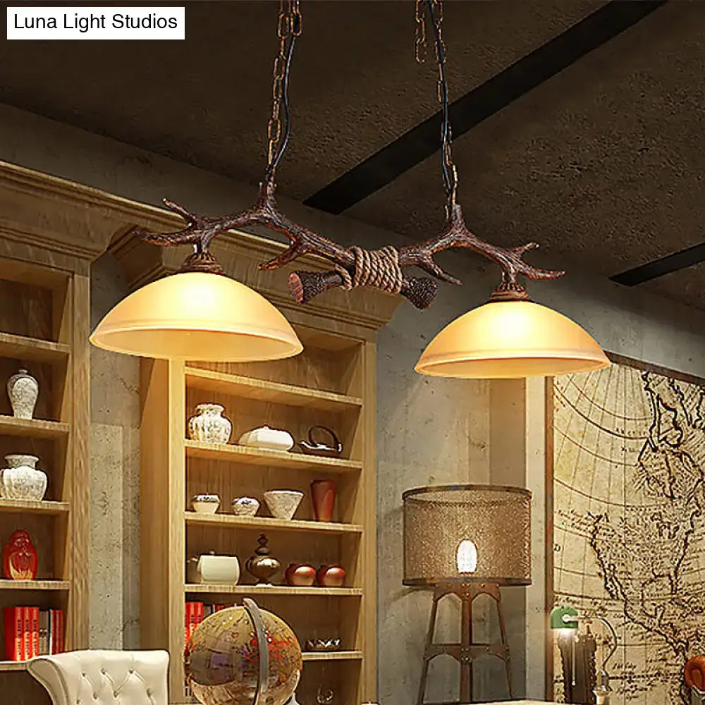 Antique bronze deer antler chandelier with two warm glass shades suspended by chains for 110v-120v and 220v-240v use