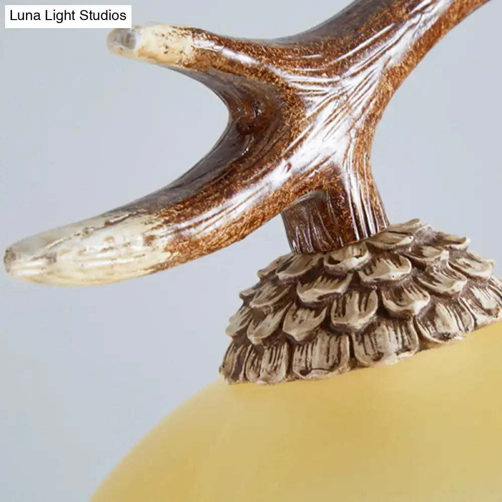 Decorbites rustic glass hanging lamp with amber bowl shade and antler-topped acorn lamp base in matte brown cream 110v-120v 220v-240v