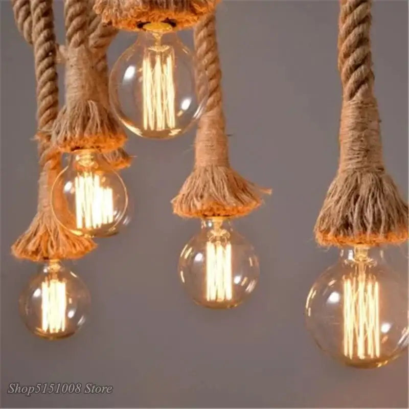 Rustic bamboo hemp rope pendant lights with warm glowing filament bulbs and natural jute rope suspension decorbites hemp rope
