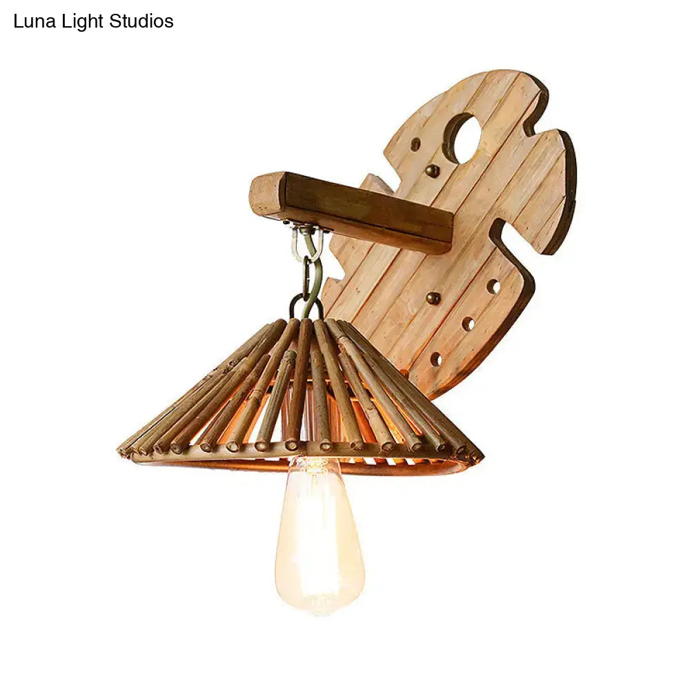 Rustic bamboo wall sconce with wood backplate and rattan monstera leaf design featuring vintage edison e26 e27 bulb