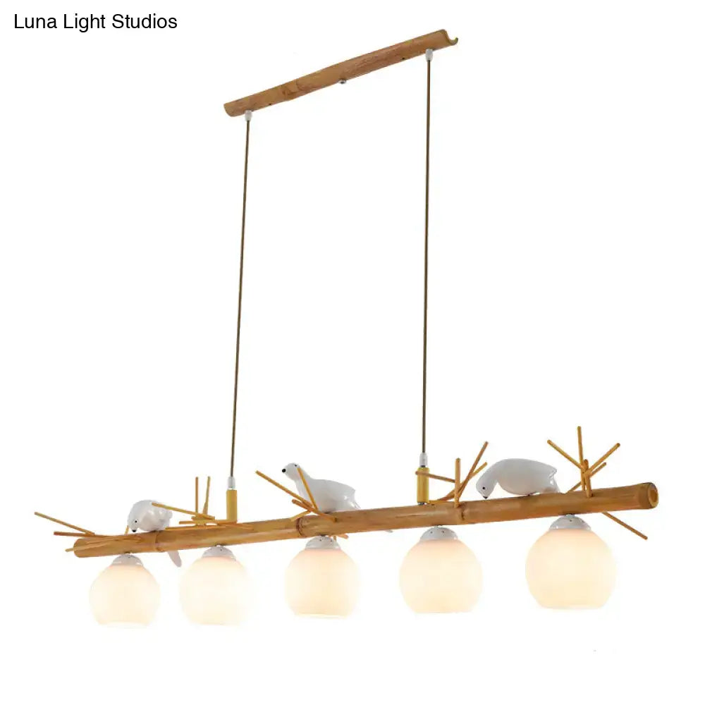 Decorbites modern cream glass wood pendant light with white bird deco on a dome island wood branch light fixture