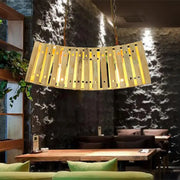 DecorBites™ asian style bamboo linear island chandelier with curved wooden slats and warm yellow lighting in beige
