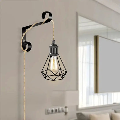Rustic beige and black pendant light with geometric metal cage, edison bulb, and natural hemp rope light cord for living room