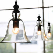 DecorBites black single ceiling pendant lamp with clear glass bell shade and exposed bulb in a rustic design