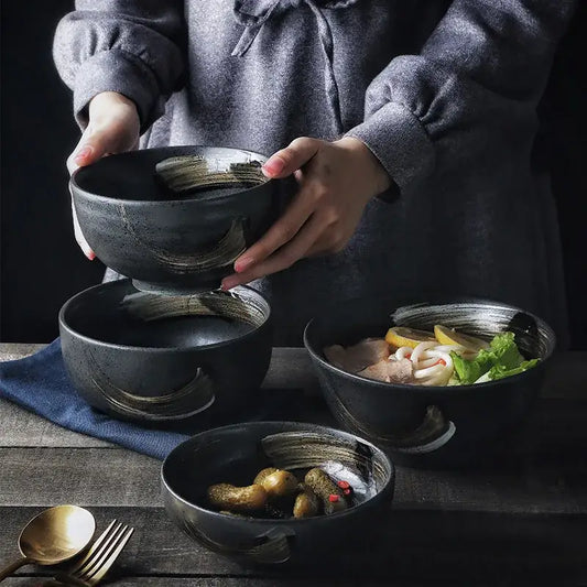 Rustic black ceramic sushi plate and bowl set with gold brushstroke accents and integrated handles for decorbites black ceramic collection