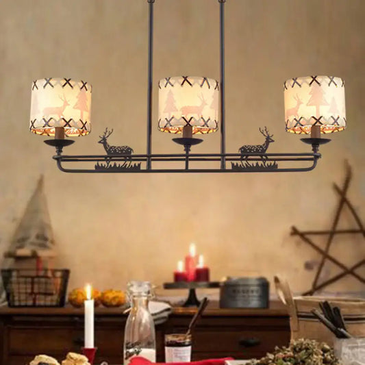Rustic black metal deer chandelier with three cream fabric cylindrical lampshades in barrel shade shape for dining room