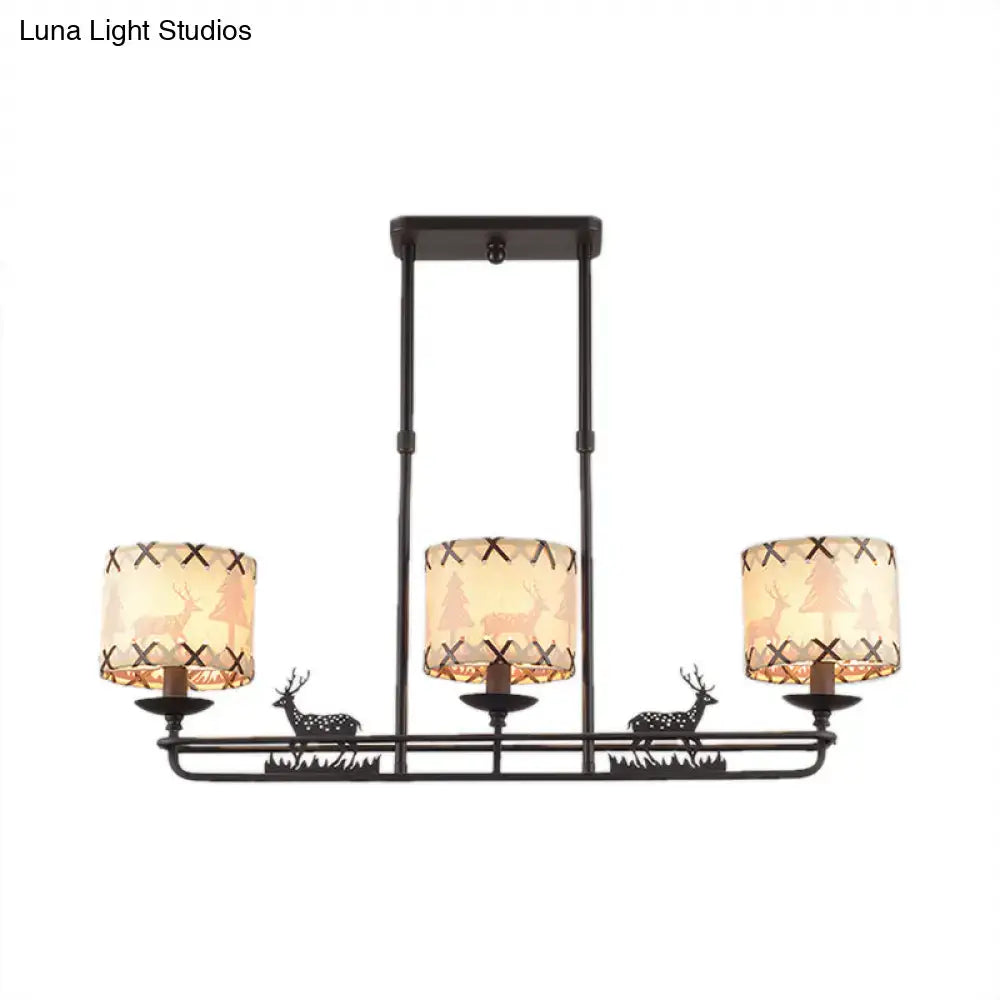 Rustic black metal deer chandelier with three beige barrel shade shape lampshades featuring tree silhouettes