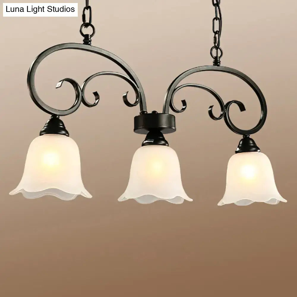 Black wrought iron chandelier with frosted white glass bell shades and black floral swirls ideal for restaurants