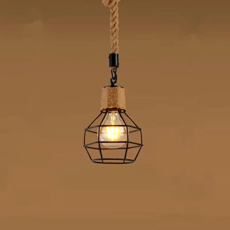 Rustic black iron pendant light with hemp rope suspension and clear glass bulb, ideal for dining room lighting