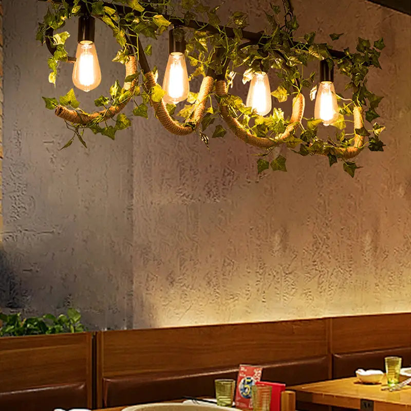 Rustic decorbites black metal 4-light linear island lamp with glowing edison bulbs wrapped in twine and green ivy vines