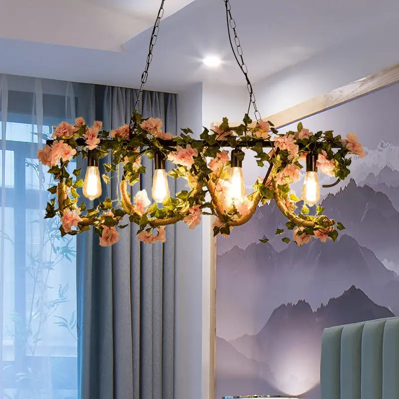 DecorBites black metal 4-light linear island lamp with rustic wrought iron chandelier and hanging artificial flowers