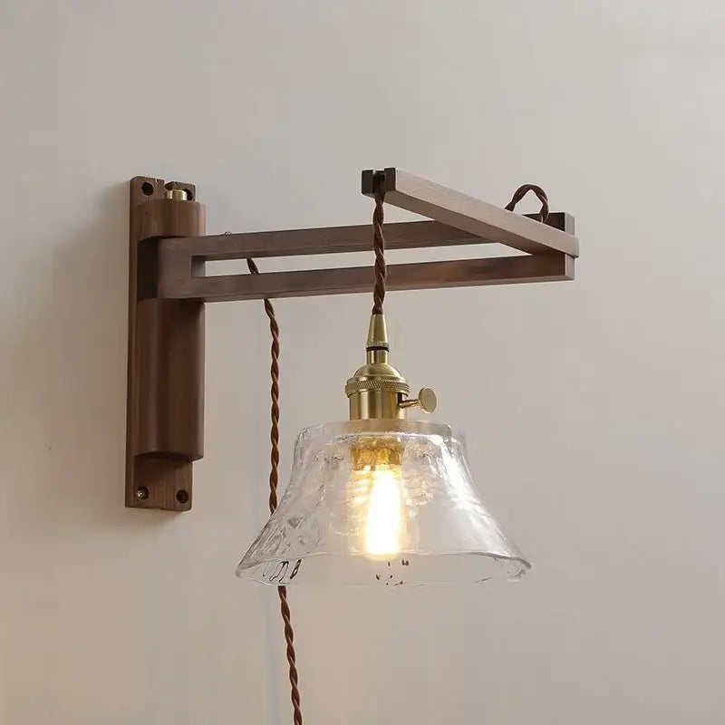 Rustic brass and clear glass wall sconce with wooden mount featuring decorbites clear glass shade for stair lighting