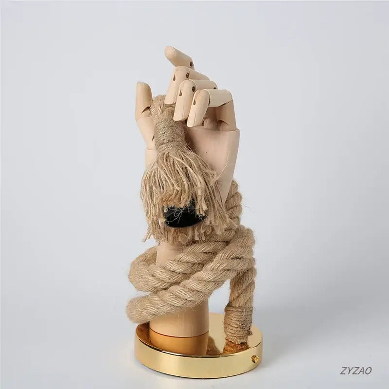 Rustic beige wooden hand shape wall lamp wrapped in light brown jute rope for bedroom wall light decoration