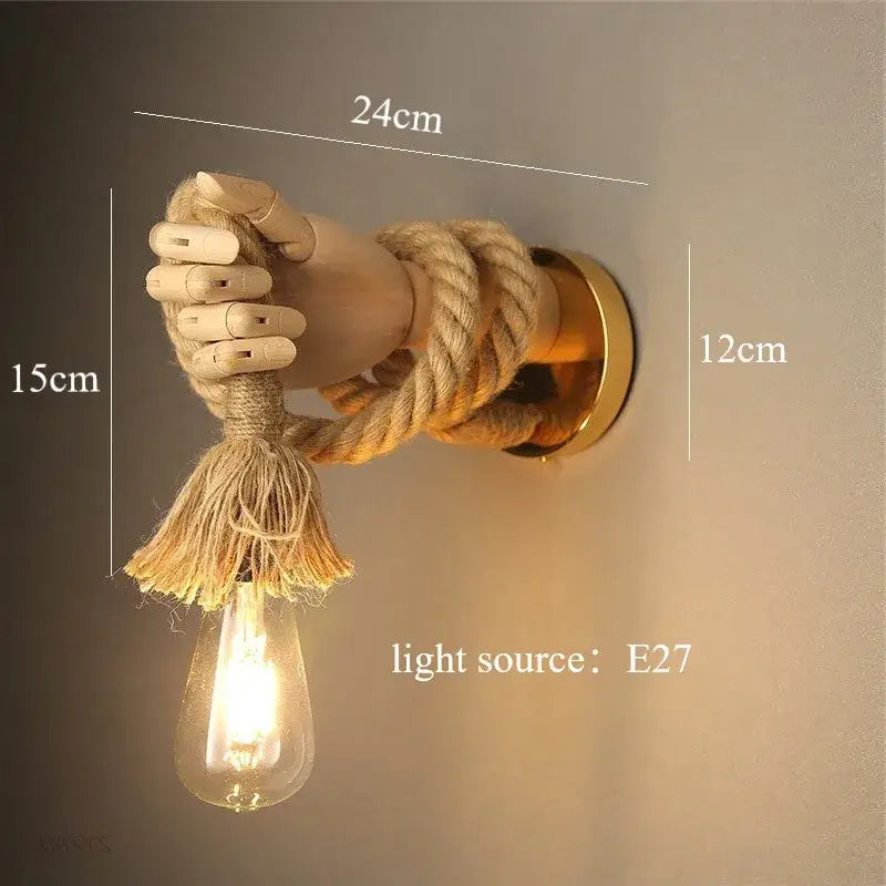 Rustic brass hand shape wall lamp with wooden hand holding hemp rope and exposed edison bulb wall light