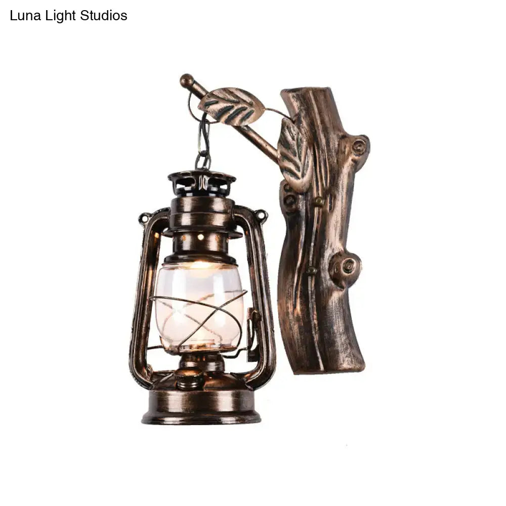 Antique bronze-finished oil lantern wall sconce with rustic tree trunk mount and leaf accents for corridor lighting