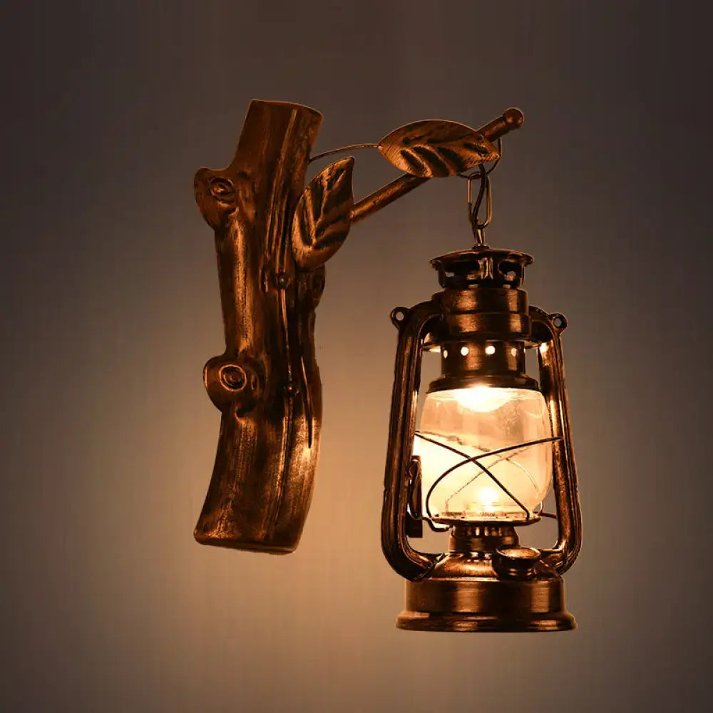 Antique brass-finished oil lantern wall sconce with rustic wooden branch design and clear glass for corridor lighting