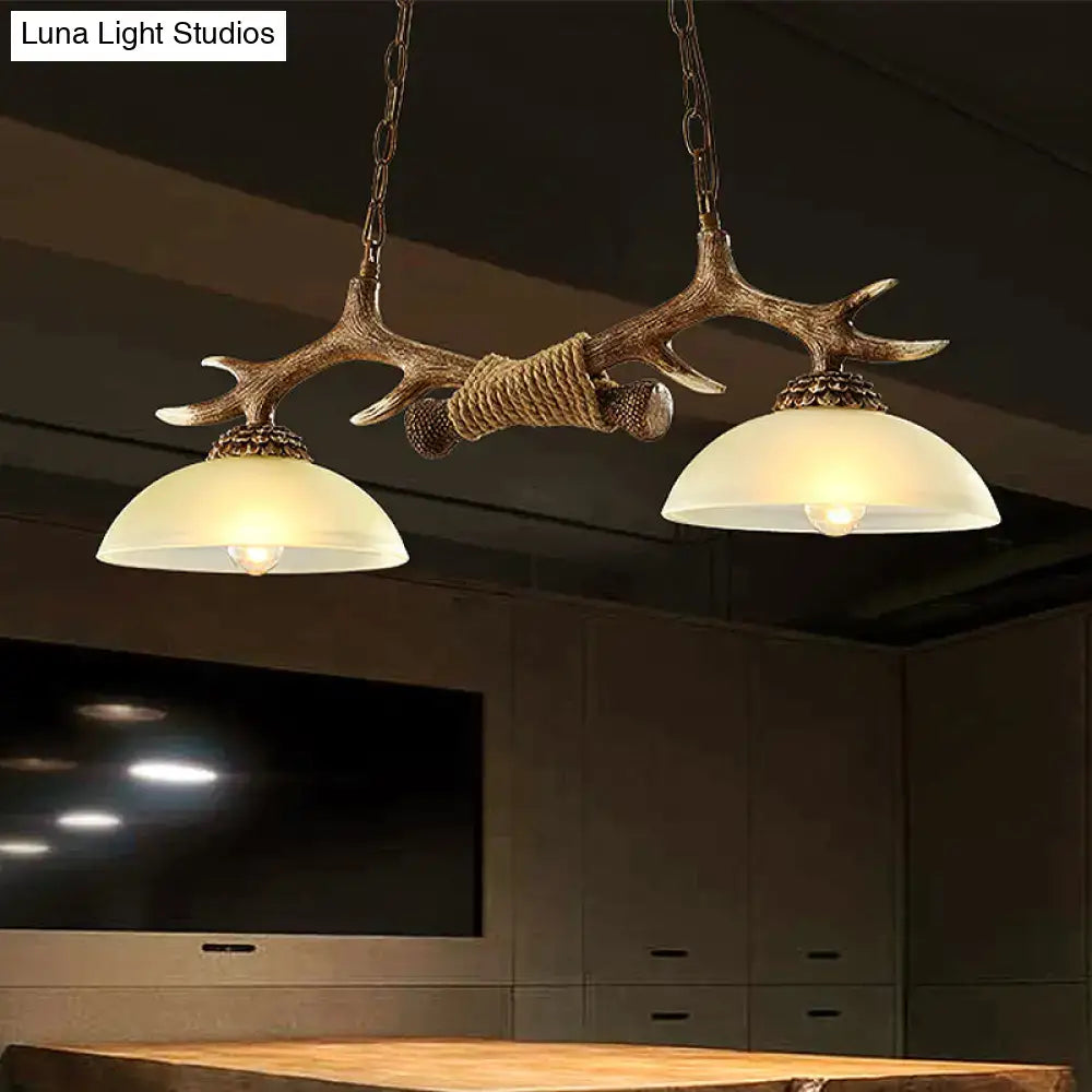 DecorBites brown glass island lamp with antler-themed bronze suspension light featuring frosted glass shades and rope wrap