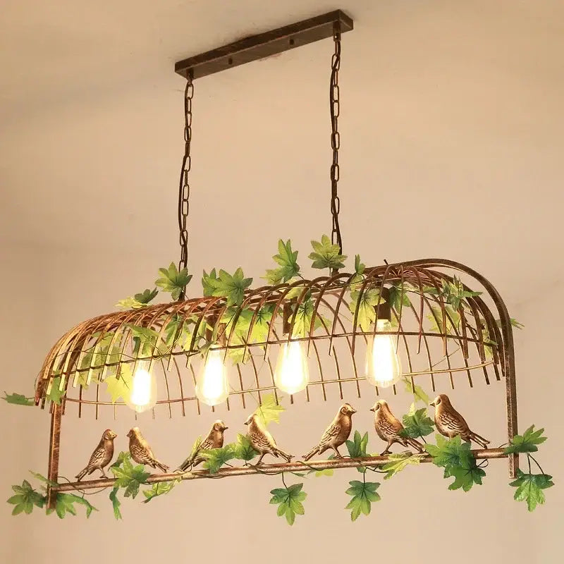 Rustic bronze green leaf bird cage chandelier with woven wire frame and exposed bulb sockets for dining room lighting