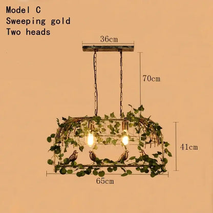 Rustic bronze green leaf bird cage chandelier with sweeping gold two-head pendant light and artificial vines and birds
