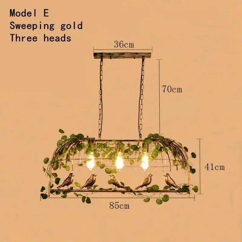 Sweeping gold three-head pendant light with ornate bird and vine design in rustic bronze iron bird cage chandelier decorbites iron bird