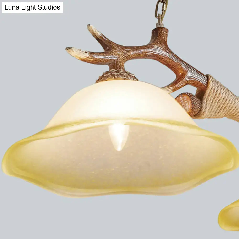 Decorbites traditional bell ceiling light with warm frosted glass shade and rustic twine-wrapped antler bulb base in flaxen fabric