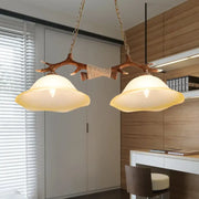 Decorbites 2-light traditional bell glass island pendant in brown with antler-themed wooden branch and warm incandescent shades