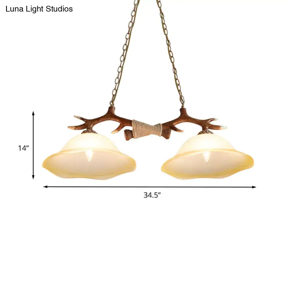 Decorbites™ 2-light traditional bell glass island pendant in brown with antler-themed metal frame and warm led incandescent shades
