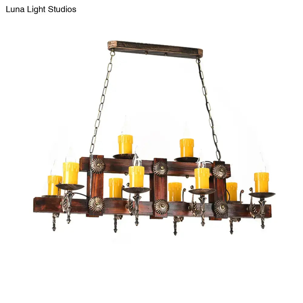 Rustic brown candle island lighting fixture with dark wood chandelier and ornate metal candle holders for dining room island lighting