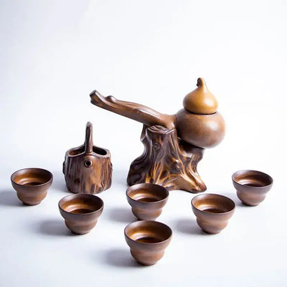 Rustic brown ceramic tea set featuring a gourd-shaped teapot with tree stump base and matching cups for tea brewing decorbites ceramic kung