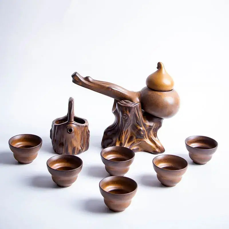 Rustic brown ceramic tea set featuring a gourd-shaped teapot with tree stump base and matching cups for tea brewing decorbites ceramic kung