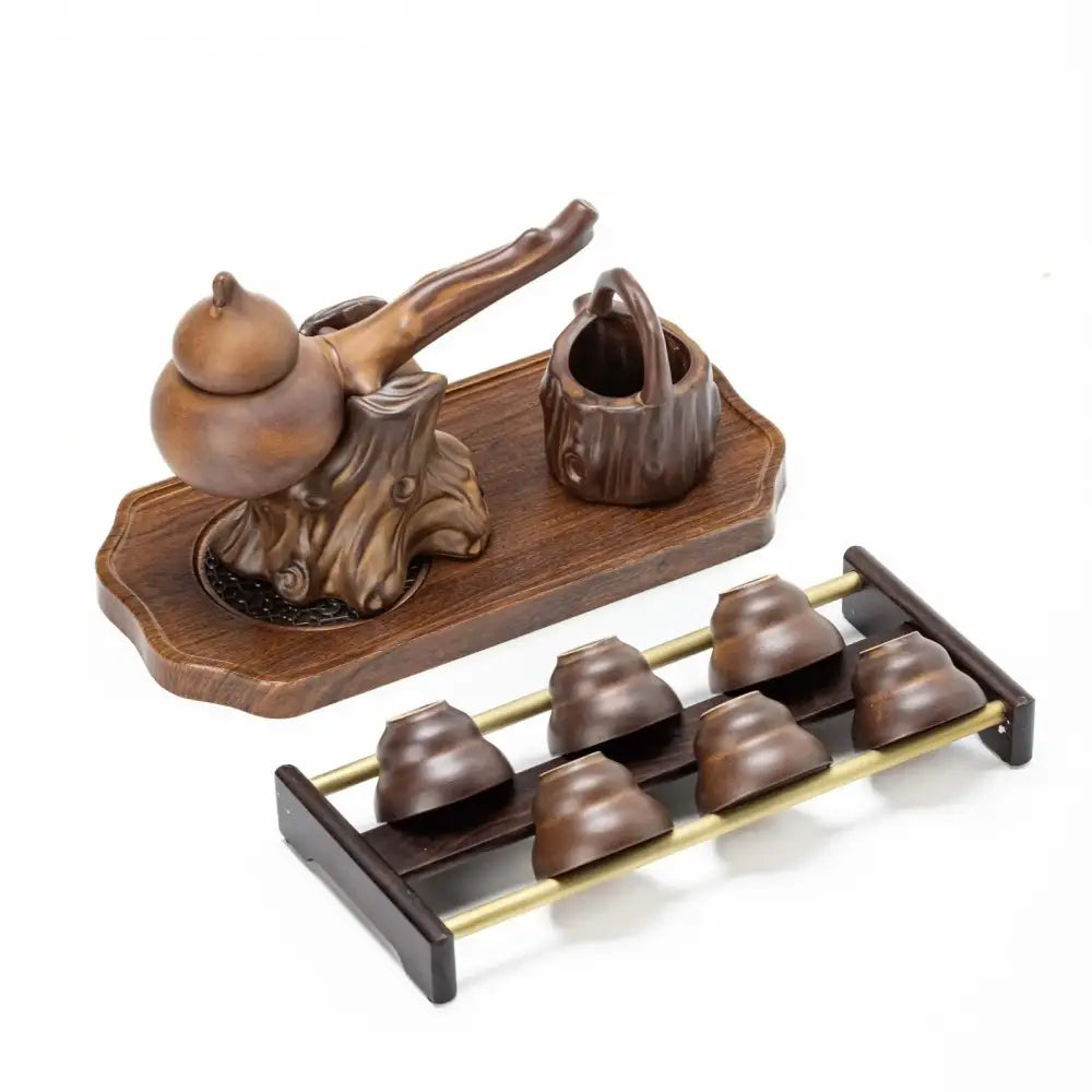 Rustic brown ceramic tea set with carved teapot water pitcher and six cups on tray for tea brewing decorbites ceramic kung