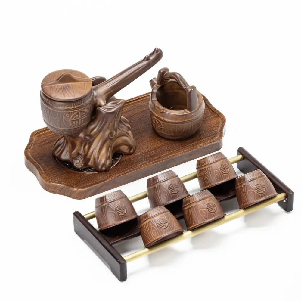 Rustic brown ceramic tea set with carved barrel-shaped teapot and six cups on tray for tea brewing decorbites ceramic kung