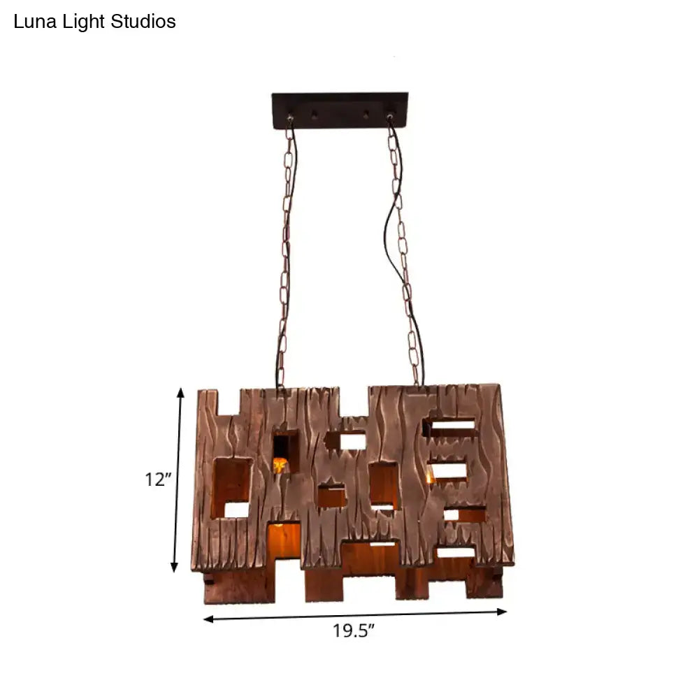 Bronze-colored rustic wooden pendant light with textured carved design and rectangular cutouts for restaurant island chandelier