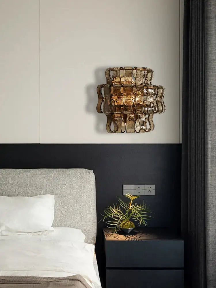 Rustic dark brown amber-tinted glass wall sconce lamps with a sculptural woven layered design for living room decor