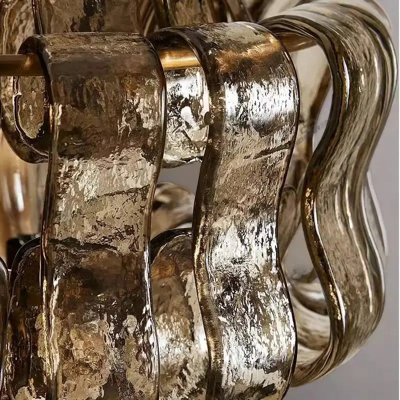 Rustic dark brown glass wall sconce lamps featuring a sculptural chandelier design with hammered gold and silver shades