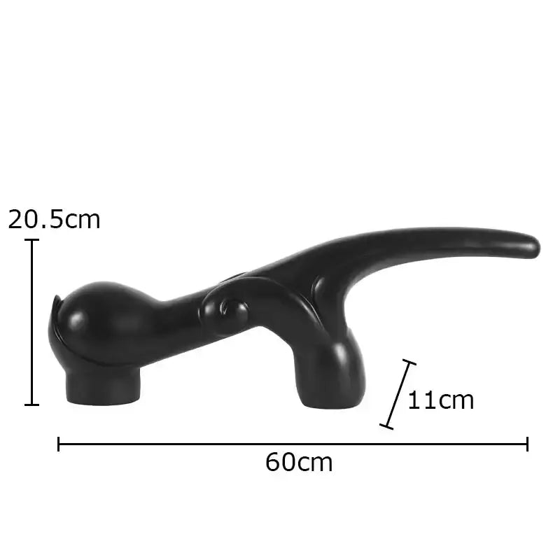 Black glossy plastic handle with ergonomic grip on rustic dark metal geometric knot resin sculpture decorbites geometric knot