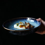 Rustic deep blue speckled ceramic salad bowl with dark brown rim holds sunny-side-up egg and seared meat by decorbites ceramic