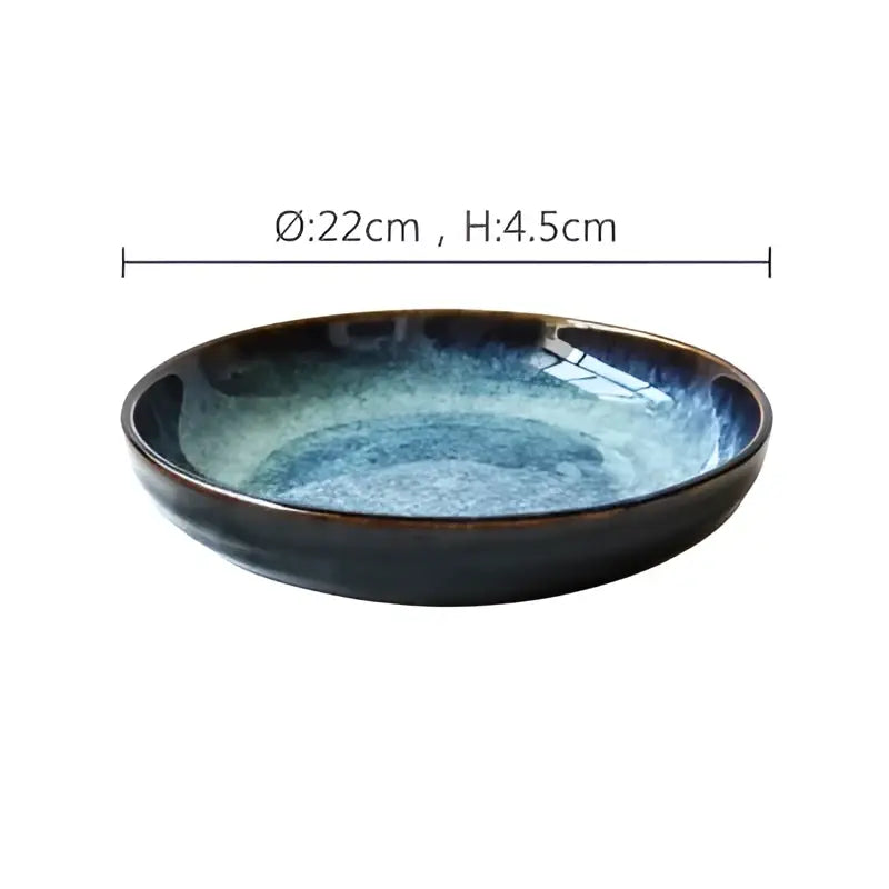 Rustic decorbites ceramic salad bowl with a deep blue speckled gradient glaze and raised edges for dining room use
