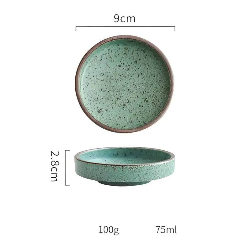 A ceramic round sauce dish with speckled teal glaze and brown rim from the decorbites ceramic round set