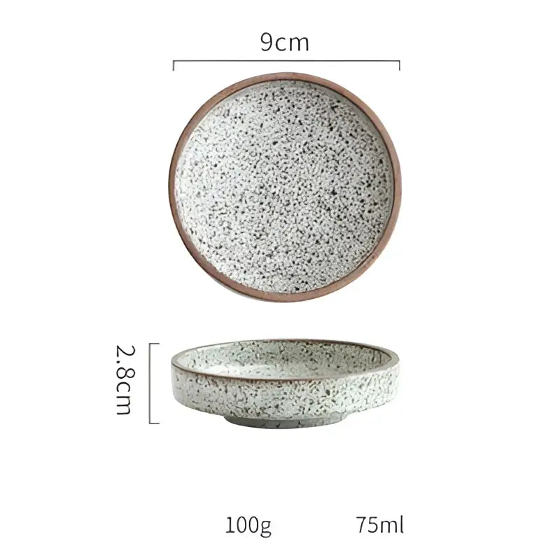 A 9cm ceramic round sauce dish with speckled gray white glaze and brown rim from decorbites ceramic round set