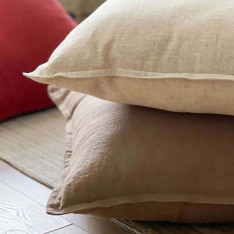 Beige linen fringed pillow cover with subtle textured weave and softly folded edges for rustic earthy decorbites decor