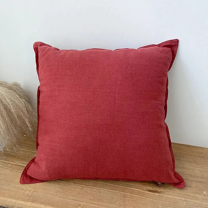Deep red linen fringed pillow cover with soft textured weave and slightly frayed edges for rustic living room decorbites decor