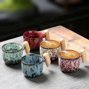 Handcrafted rustic glazed ceramic latte mug with light wooden handle for kitchen drinkware use